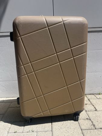 Gebrauchter Reisekoffer goldfarbig