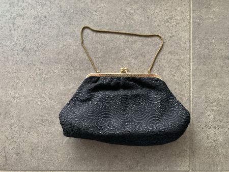Elegante Vintage-Handtasche, schwarzes Spitzenmuster