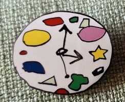 J778 - Pin Farbige Uhr