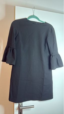Elegant black dress with ruffle sleeves - size small