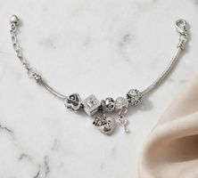 Bracciale tipo pandora con charm nuovo