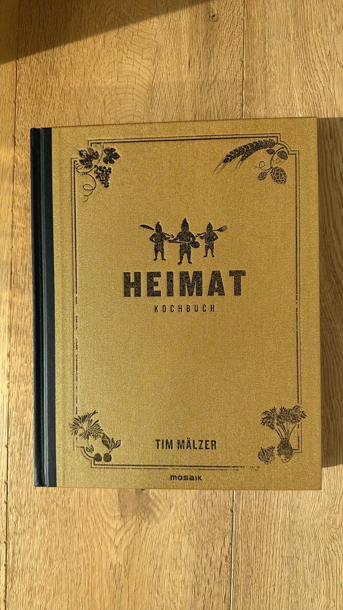 Libri: Heimat Kochbuch von Tim Mälzer – Nuovo (secondo la descrizione) da Celerina/Schlarigna venduto da golfrolf2