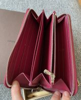 Portefeuille Louis Vuitton Epi fuchsia, zippé en bon éta