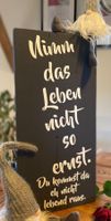 Schild „Nimm das Leben nicht so ernst“