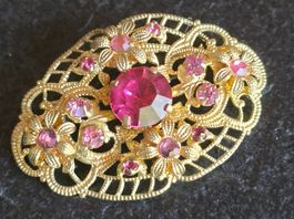 Brosche goldfarben mit rosa Steinen floral verziert