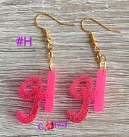 Boucle d’oreille en lettre