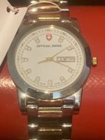 Montre OFFICIAL SWISS acier doré  occasion