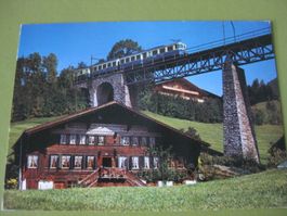 AK Gstaad mit Brücke und Zug
