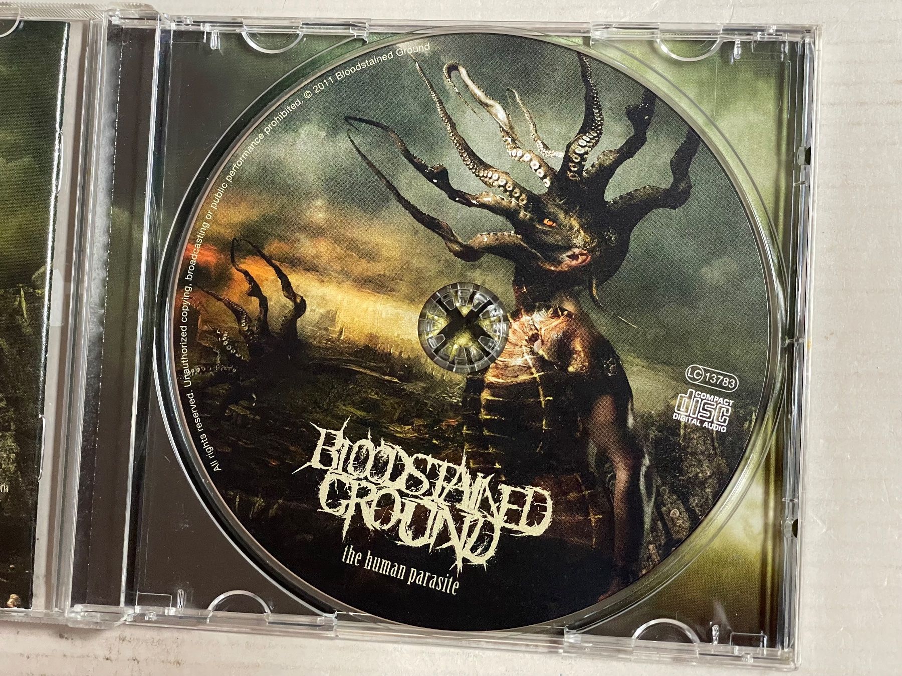 CD: Bloodstained Ground - The Human Parasite – Usato da Muri b. Bern venduto da AdidasCollector 3