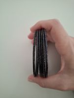 Bracciali rigidi neri in metallo, con brillantini. NUOVI