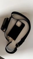 Ideal of Sweden IPhone 14 Pro case with strap and small bag