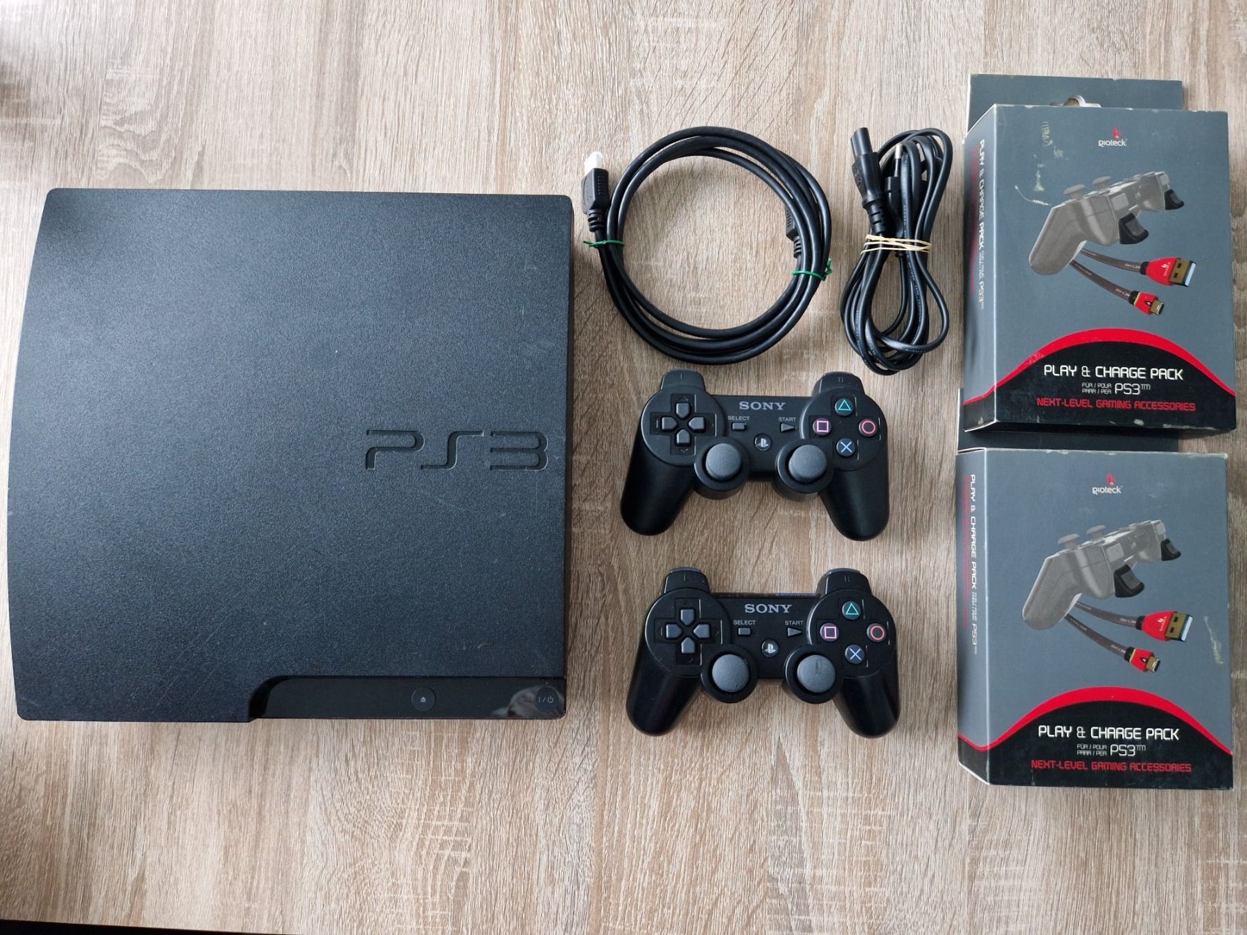 Sony Console: Ps3 Slim + 19 Games + 2 Kontroller + "Play & Charge Pack" – Usato da Rebstein venduto da Ajs_Toy_Palast_1