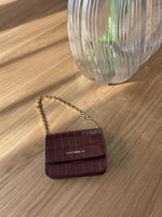 Coccinelle Portemonnaie/Mini Tasche Kroko Optik