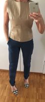 Blazer, der mit einem Gilet aus Echtleder