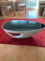 Couchtisch oval Glasoberflaeche schwarz modern