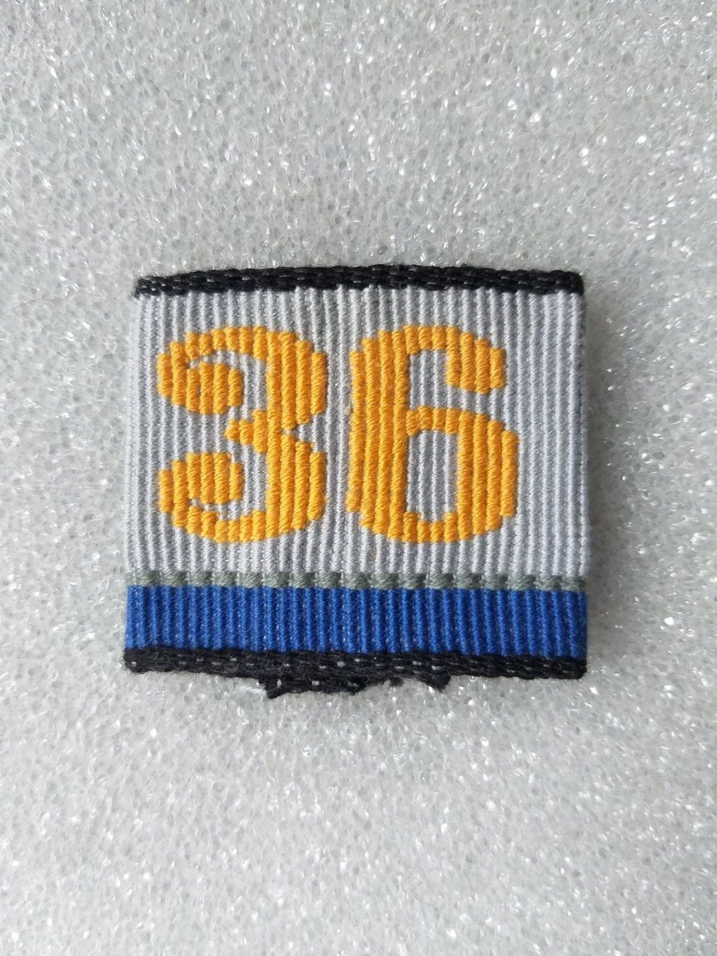 Placchette & Badge: Achselschlaufe Übermittlung Bat 36 Kp 4 – Usato da Bauma venduto da SwissMilitaria