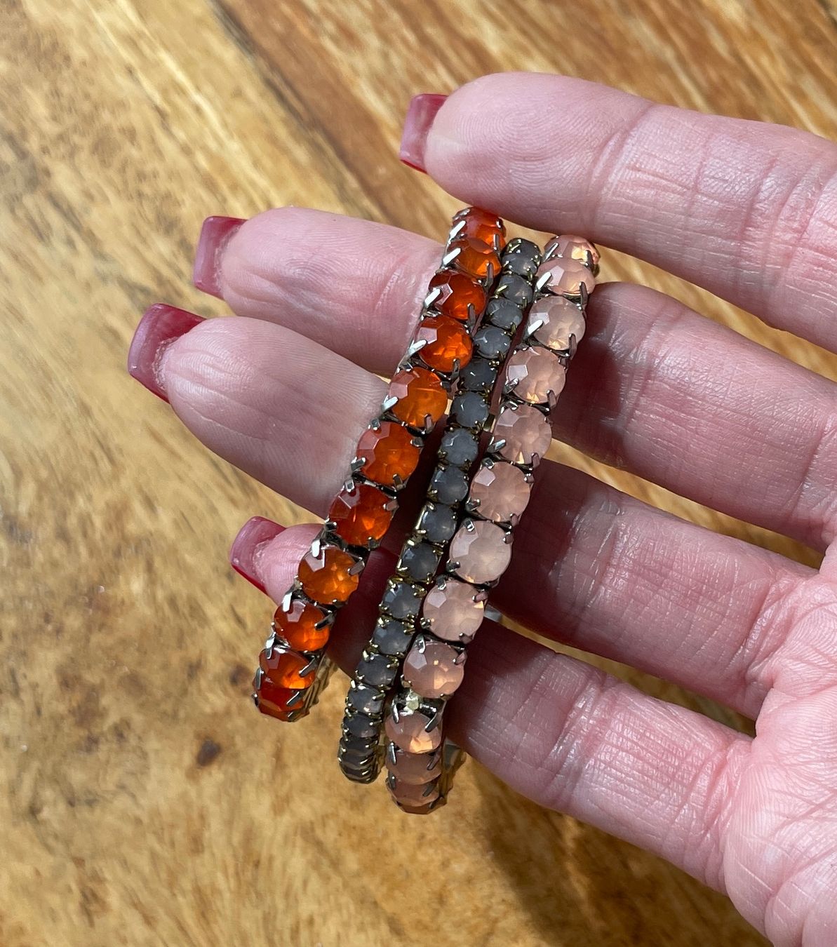 Bracciali & Braccialetti: 3 Stretcharmbänder – orange, lachs, olive – Usato da Grenchen venduto da M_ina 1