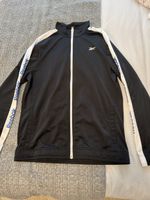 Veste Reebok noire taille L, parfait pour le printemps!