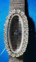 Montre dame Gübelin (or blanc et 26 diamants)