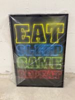 Wandbild "Eat. Sleep. Game. Repeat." mit Rahmen