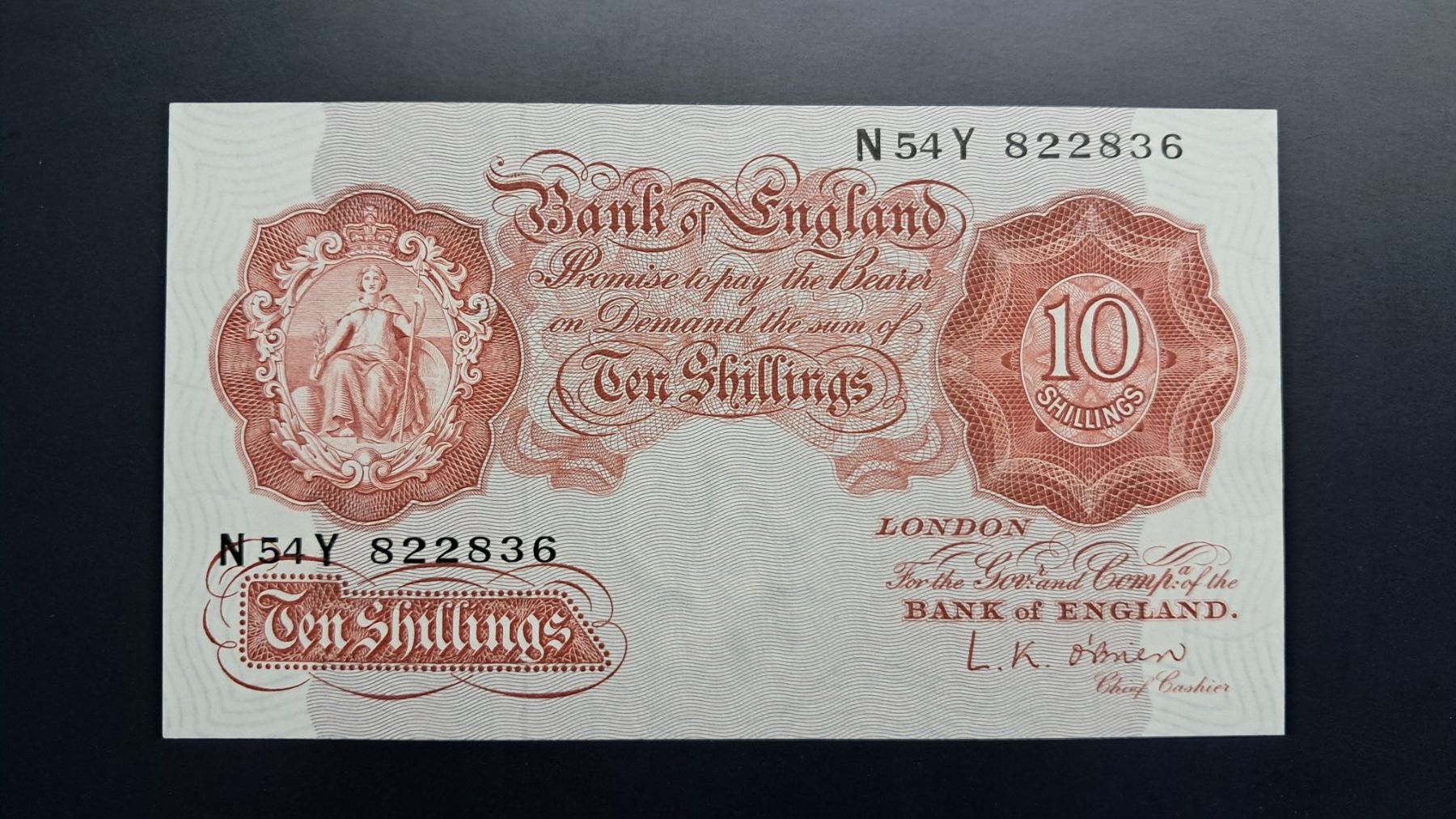 Banconote: Grossbritanien 10 Shilings 1955-60 Unc – Nuovo e nell'imballaggio originale da Lufingen venduto da E-Auktion