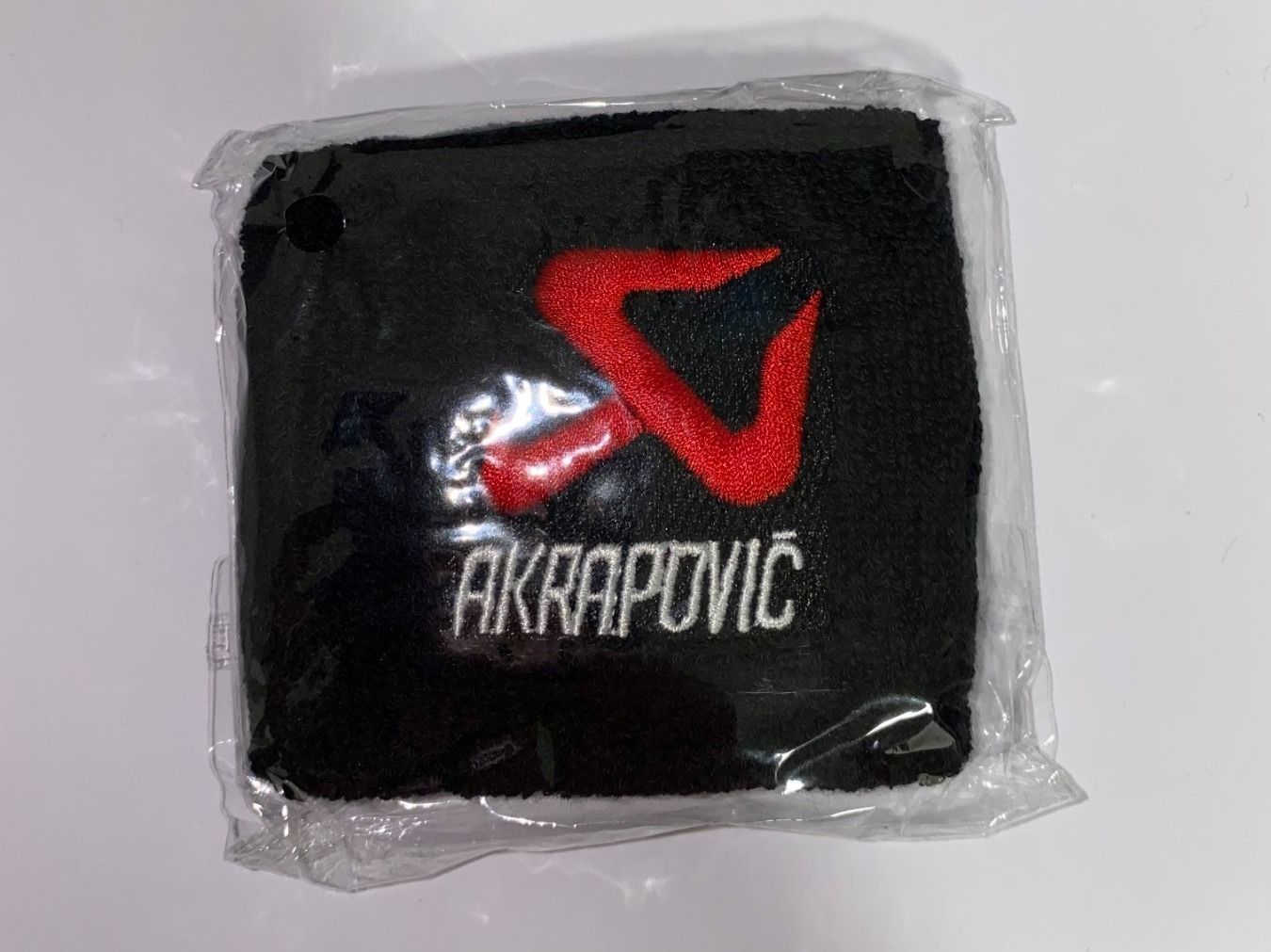 Bracciali & Braccialetti: Akrapovic Schweissband – Nuovo e nell'imballaggio originale da Aarburg venduto da Moto.fans.swiss