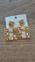 boucles d'oreilles dorée cristal avec reflets blanc rose