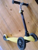 Gelber Dreirad Tretroller Marke Oxelo