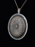 Pendentif broche ancien en argent orné d'une perle