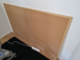 Large cork board with wooden frame