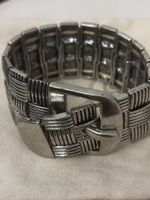 Bracelet argenté style tissé avec boucle, bon état