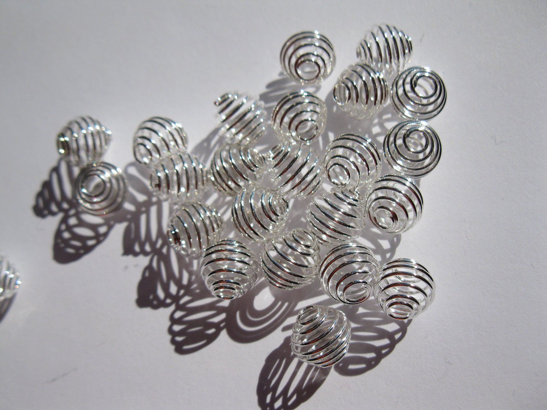 Perle (finte): 10 Metallperlen Spirale, versilbert 11x9 – Nuovo e nell'imballaggio originale da St. Margarethen TG venduto da LuanaKa