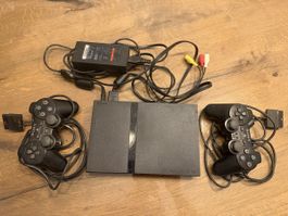 Sony PlayStation 2 Konsole mit Zubehör und zwei Spielen
