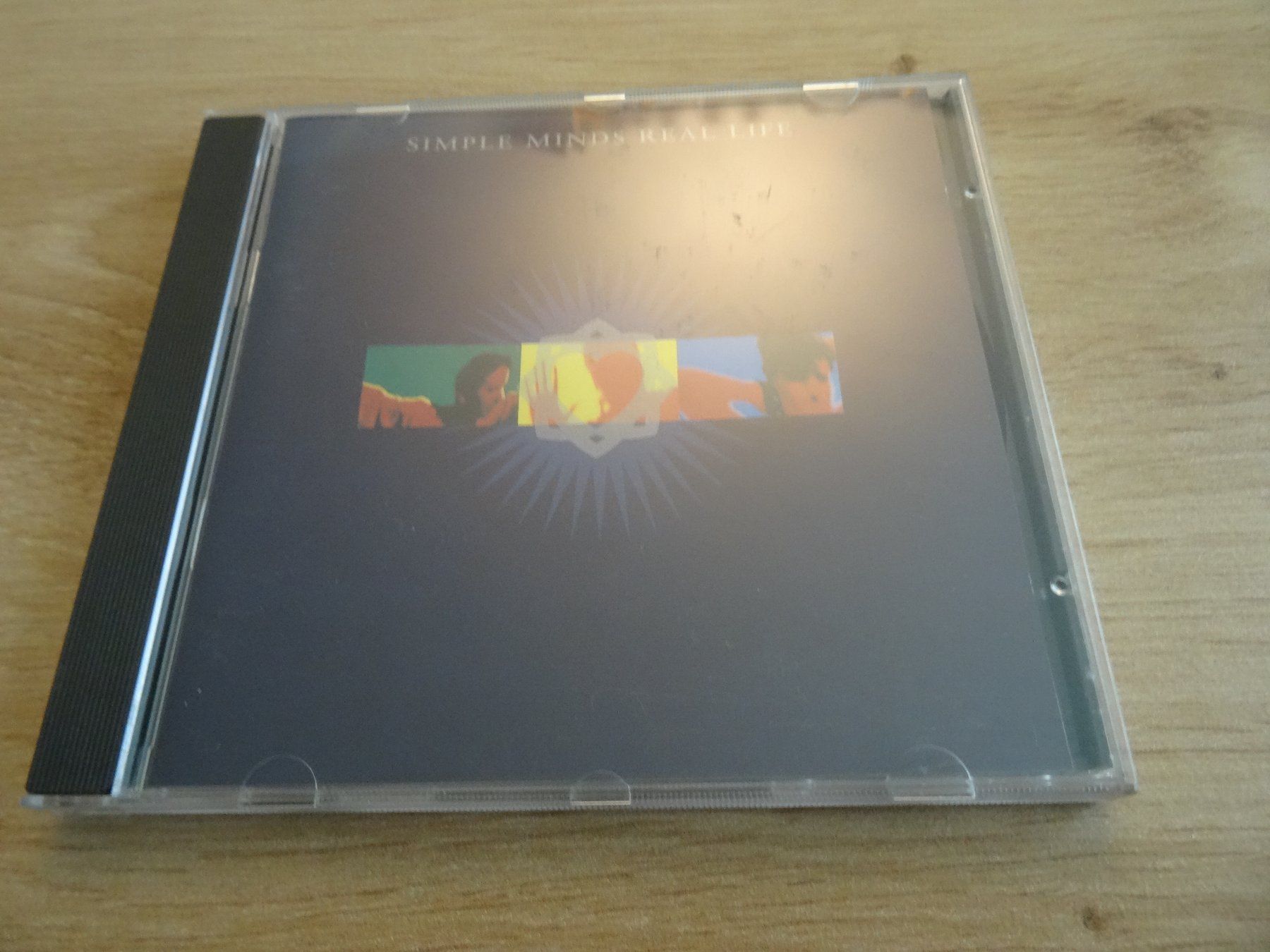 CDs: Simple Minds - Real Life CD – Gebraucht aus Olten von Disc-Ausverkauf