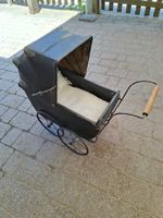 Antiker Puppenwagen - nostalgischer Charme für Sammler