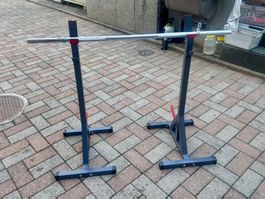 Rack con bilanciere e cuscino per il collo