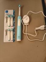 Oral-B Pro Series 1 elektrische Zahnbürste + 4 Bürstenköpfe