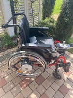 Fauteuil roulant électrique rouge état acceptable