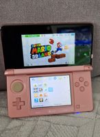 Nintendo 3DS pink + Super Mario 3D Land Spiel, Ladekabel.