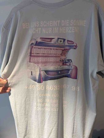 T-Shirt mit Solarium Aufdruck Hellblau Grösse M