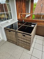 Platzsparende Rattan-Sitzgruppe