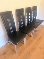 4 Stühle in schwarz Kunstleder 