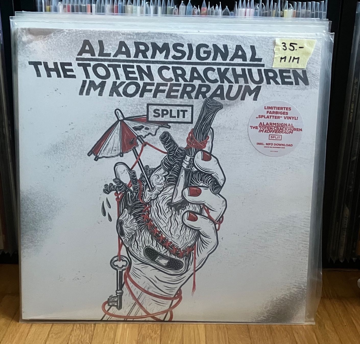 Dischi in vinile: ALARMSIGNAL / THE TCHIK - Split 12" EP - (col. Vinyl) – Nuovo e nell'imballaggio originale da Maienfeld venduto da Jack.R
