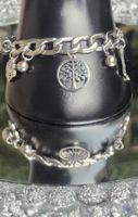 Bracciale con ciondoli albero e farfalla