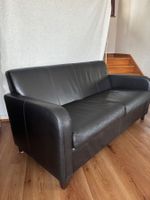 Dunkelbraunes Ledersofa