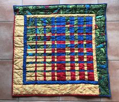 Tapis mural aux oiseaux en patchwork