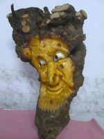 In Holz geschnitztes Gesicht