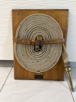 Feuerwehrschlauch auf Holzbrett,, Kreis & Schläfli, Zürich,
