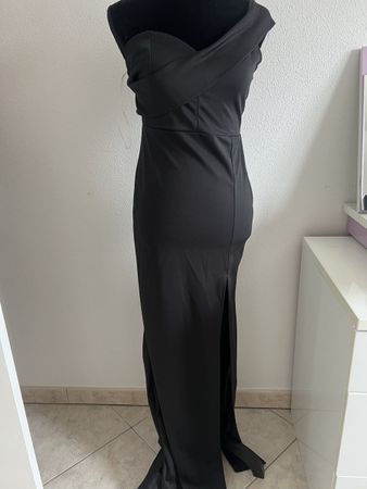 Magnifique robe noire - neuve - très moulante et séduisante