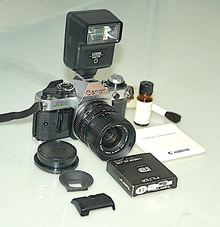Canon Kamera: Analoge Canon AE-1 Program Spiegelreflexkamera mit Blitz – Gebraucht aus Winterthur von Meiermueller 1